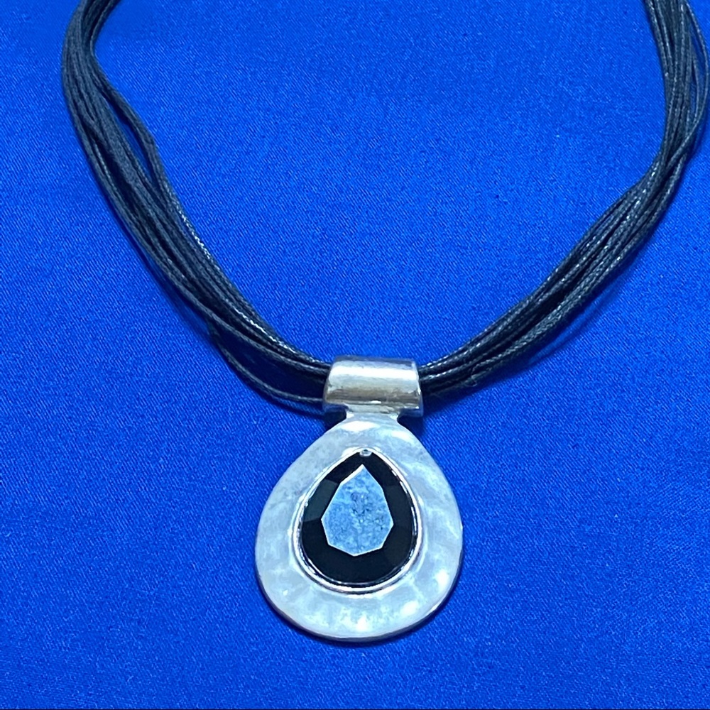 Multi strand pendant necklace.